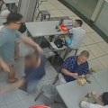 A Singaporean food stall worker was shoved to the ground after patting a child on the head.