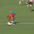 AFL umpire left holding his shoulder after colliding with Gold Coast's Touk Miller.