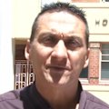 Police have raided seven properties and arrested two men as they trace the movements of Dezi Freeman in his seven months on the run.