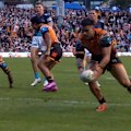 Taylan May hands a 12-point lead to the Wests Tigers as he finds space to score. 