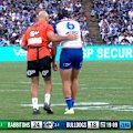 Matt Burton receives medical attention for the trainer as he clutches at his shoulder.