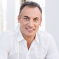 Media baron Antony Catalano will be allowed to move his family overseas after being accused of choking and threatening to kill his wife.