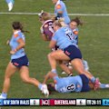 Millie Elliott drops to the ground after a head clash but stays on the field.