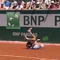 Toby Samuel hits the clay at the French Open after a winner from Alex de Minaur.