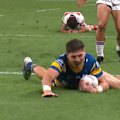Sean Russell blasts over the tryline to open the scoring for the Parramatta Eels.