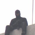 A stand-off that followed the spray-painting of a Pam the Bird graffiti image on Melbourne's Bolte Bridge has ended with a man's arrest.