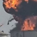 Fuel storage tanks are ablaze at a port in Oman after an Iranian drone strike.