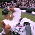 Novak Djokovic plays a cheeky prank on the ballgirl before advancing to the Wimbledon third round.