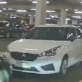 Dramatic video of a police officer driving through a suburban car park, dodging cars to track down an offender, is gaining international attention.
