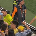 AFL umpires have been pelted by bottles leaving the MCG by Hawthorn fans.