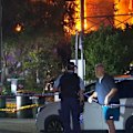 A major fire has engulfed a house in Sydney's inner west and spread to neighbouring properties.