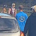 A professional fighter has stepped in to protect two young girls who were approached by a man who stopped their car and tried to open their door on the Bruce Highway near Landsborough on the Sunshine Coast.