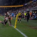 Josiah Karapani jumps over the corner to level the scores at Commbank Stadium and keep the Broncos in the competition. 