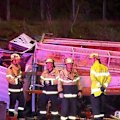 A truck has rolled and narrowly missed traffic on the South Eastern Freeway in Adelaide.