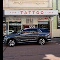 A Fremantle tattoo shop is gearing up to work until punters stop coming through the door come Saturday afternoon, with a selection of Flagmantle designs on offer should the Dockers take home their inaugural premiership.