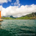 The day breaks over Hokulea with Kualoa behind her. 