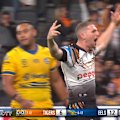 Tigers halfback Adam Doueihi beats multiple defenders to score a crucial try against the Eels.