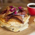 Organic spelt pancakes with candied bacon and maple syrup.