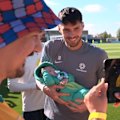 The Socceroos were cheered on by a sea of green and gold in California at base camp as friends, family and fans all caught a glimpse of the football heroes.
