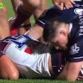 Sea Eagles prop Siosiua Taukeiaho suffers a leg injury while scoring a try against the Broncos. 