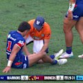 Warriors fullback Taine Tuaupiki is left grimacing after an awkward tackle from a Broncos player.