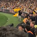 Hawthorn fans pelted debris and bottles at umpires after the game.