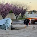 A car has been swallowed by a sinkhole on a suburban road in Perth's south.