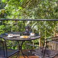 The large timber deck looking over the rainforest is a beautiful setting for some breakfast.