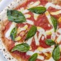 The classic margherita pizza, with an authentic charred crust.