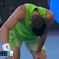 Carlos Alcaraz hunches over after Alexander Zverev's winner.