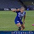 Tayla Preston cups her ears to the opposition fans after kicking a goal from the sideline.
