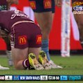 Queensland's Sam Walker comes off for a HIA after a friendly fire shot from a Maroons teammate. 