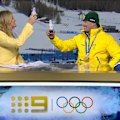 Lydia Lassila leaves a beer with a message on the bottle for Cooper Woods to celebrate his gold medal during a TV interview.
