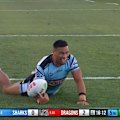 Cronulla winger Ronaldo Mulitalo scores in the corner against the Dragons.