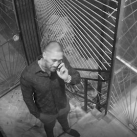 Paea Talakai, 27, speaks on the phone. He has pleaded guilty to affray in the ACT Magistrates Court after a wild bikie brawl in a Canberra strip club, the Capital Mens Club.