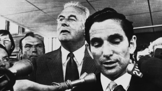 Australian Prime Minister Gough Whitlam listens as Secretary David Smith reads the proclamation dissolving both Houses of Parliament on November 11, 1975.