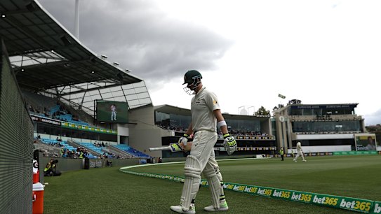 Skipper Steve Smith walks off after being dismissed on day four.