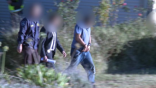 A supplied screen-grab from a video footage obtained Tuesday, Feb. 28, 2017 of Australian Federal Police arrest a man at a premises folowing a raid in Young, NSW. The AFP has charged a 42-year-old man for allegedly carrying out actions in Australia to support Islamic State activities overseas. (AAP Image/AFP) NO ARCHIVING, EDITORIAL USE ONLY .