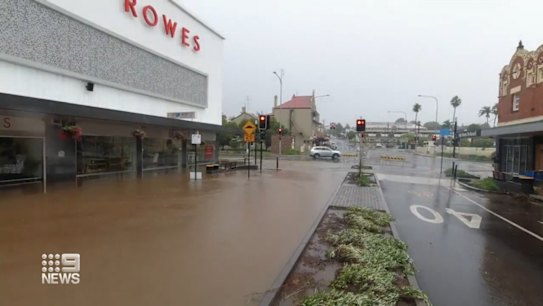 Torrential rain saw flash flooding on the NSW coast, with at least one person dead.