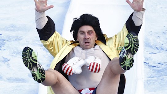 Justin Langer, former Australian cricketer and coach, goes down the slide for Big FightMND Freeze 8.