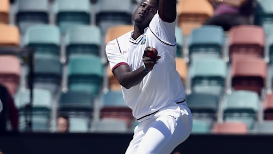 Jason Holder sends down a delivery in the first Test.