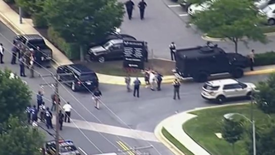 Man held over US mass shooting had 'long-running feud' with paper