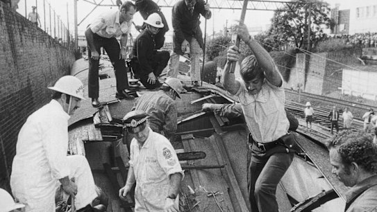 Fairfax archives Rich & Rare - Disasters. Picture by RUSSELL McPHEDRAN. An early morning, peak hour Blue Mountains commuter train from Mt Victoria, travelling into Sydney, crashed after derailing on an approach curve to Granville Station. It careered along for 46 metres before striking the supports of the Bold Street Bridge over the rail line on January 18 1977. Eighty three people died and another 213 were injured