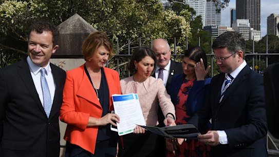 Premier Gladys Berejiklian and Roads Minister Melinda Pavey, second from left, have committed to the first three stages of the F6 extension. 