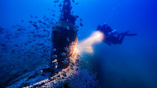 Deep blue: Maritime archaeologist Matt Carter diving on the wreck of the Japanese midget submarine off Bungan Head.