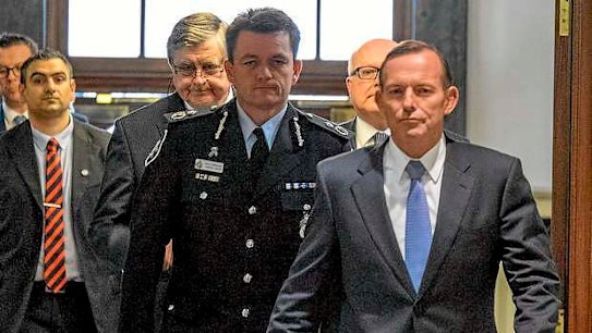 Prime Minister Tony Abbott arrives to speaks to the media during a press conference on September 12, 2014 in Melbourne, Australia.