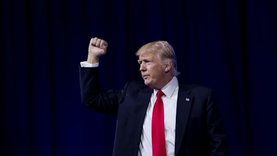 US President Donald Trump gestures on stage during the Conservative Political Action Conference (CPAC) on Friday.