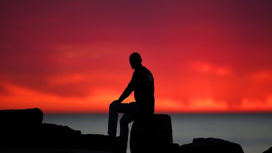 Early morning beachgoers enjoy the morning warm temperatures at North Cronulla beach.