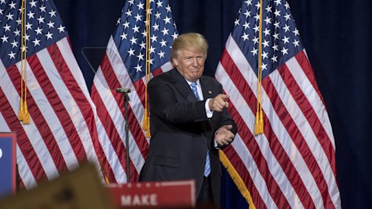Donald Trump, 2016 Republican presidential nominee, gestures at the conclusion of a campaign event in Phoenix, Arizona.