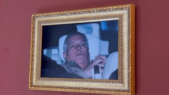 The infamous photo of Andrew Mountbatten-Windsor leaving a UK police station has made it to the top of the art world after it was hung in the Louvre.